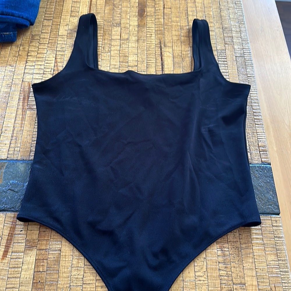 Black body suit light worn